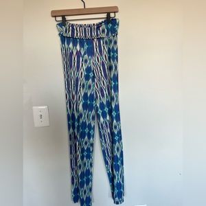 Multi-colored, fitted flare pants. Fitted. Size 6